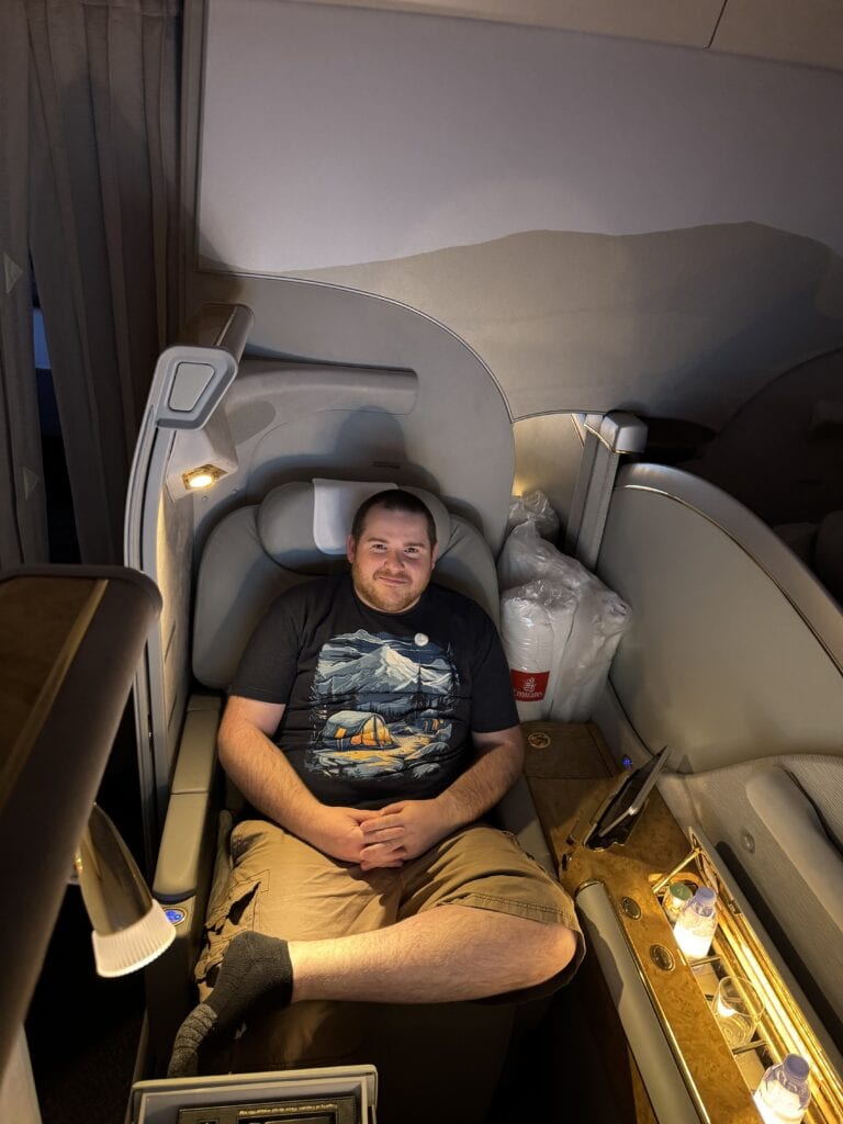 Simon Knight flying first class using Amex points earned from Qogita wholesale purchases